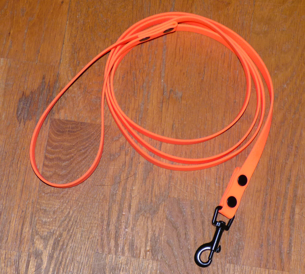 Koppel i vattenfast hexagon material, 16mm bredd, neonorange med svart pistolhake